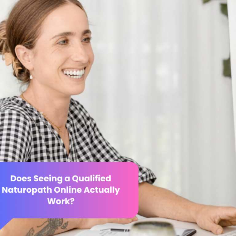 Woman smiling during an online naturopathic consultation via laptop in a calm home setting.